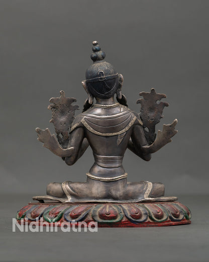 Back view of sacred Avalokiteshvara statue from Nepal showing detailed copper metalwork silver plated decorative elements and traditional Buddhist artistry