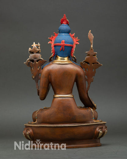 Back view of sacred Yuthok Yonten Gonpo sculpture from Patan Nepal showing lost wax copper craftsmanship oxidized finish and detailed pedestal design