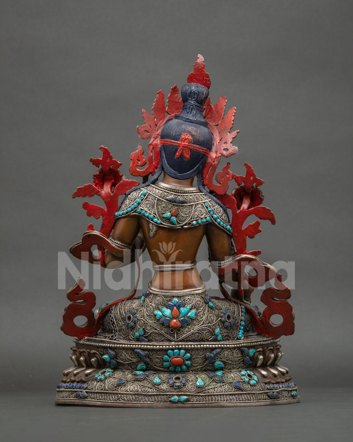 Back view of Seven-Eyed White Tara statue with filigree, gemstone inlay and red hand-painted details