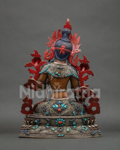 Back view of Seven-Eyed White Tara statue with filigree, gemstone inlay and red hand-painted details