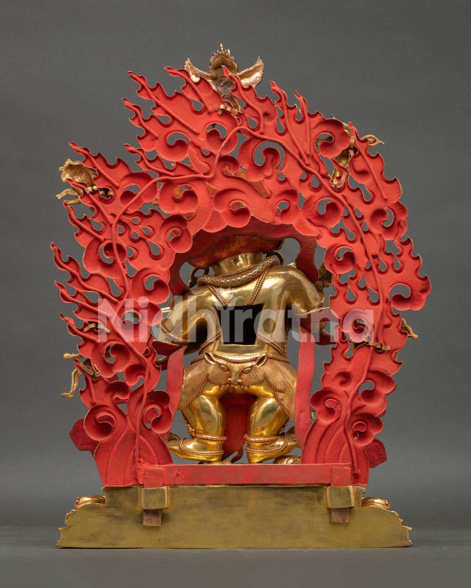 Back view of Shakya Mahakala statue displaying detailed halo, ornaments, and lotus base craftsmanship