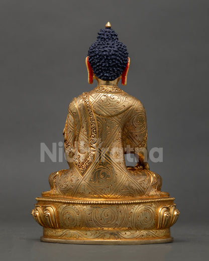 Back view of Shakyamuni Buddha figurine showcasing detailed robe engravings and craftsmanship