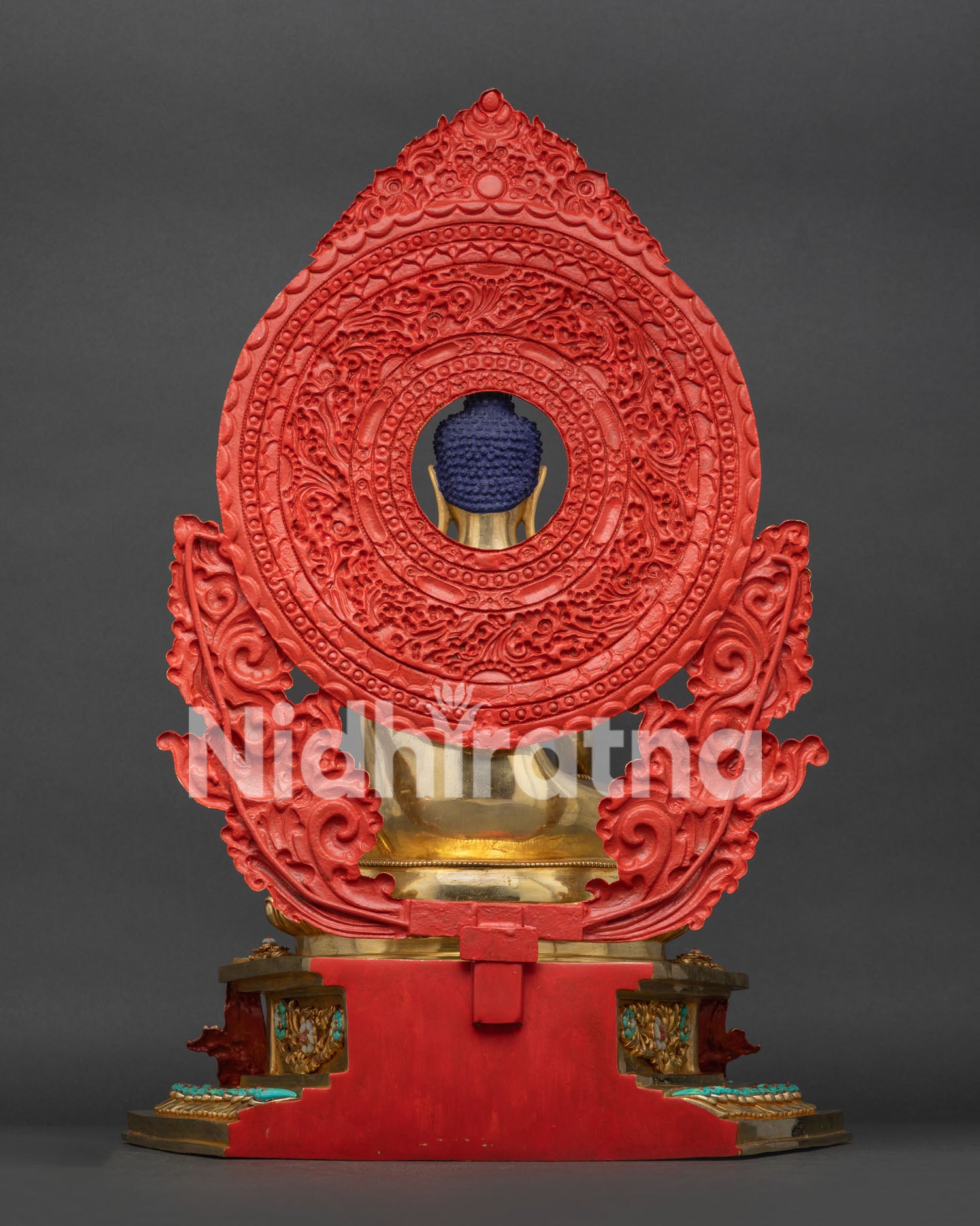Back view of Shakyamuni Buddha statue, detailed mandorla halo, repoussé dragon throne, fire-gilded copper