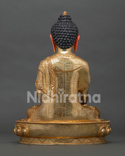 back view of shakyamuni buddha statue displaying detailed robe patterns and finish