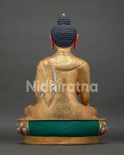 Back view of Shakyamuni Buddha statue, displaying traditional Himalayan metalwork artistry
