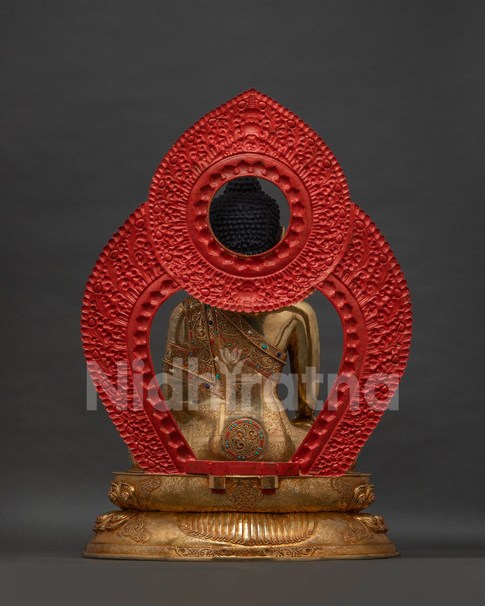 Back view of Shakyamuni Buddha statue, gold-gilded copper with lotus pedestal
