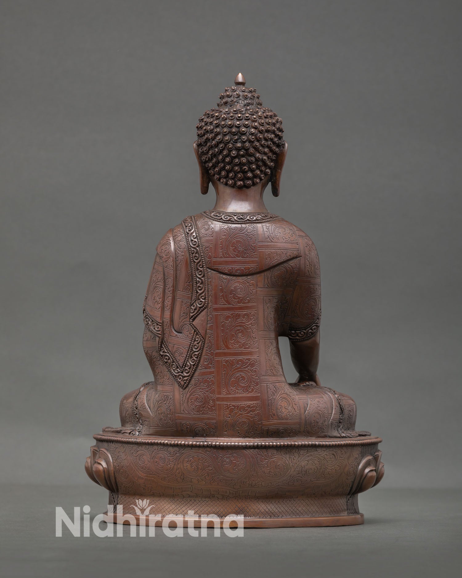 Back view of Shakyamuni Buddha statue highlighting intricate lotus throne carvings and authentic Nepalese lost wax metal casting artistry