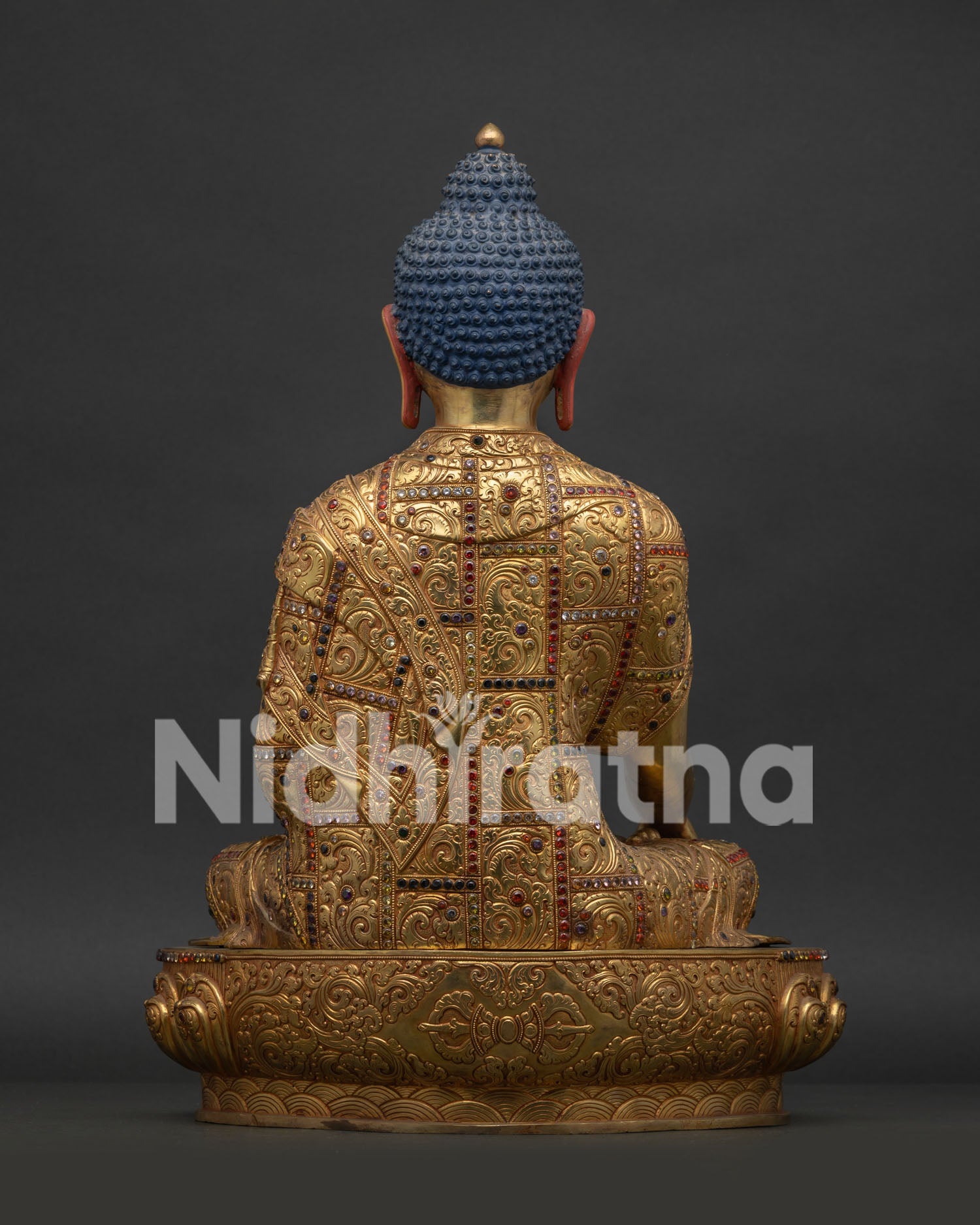 Back view of Shakyamuni Buddha Statue showcasing detailed robe carvings and copper craftsmanship