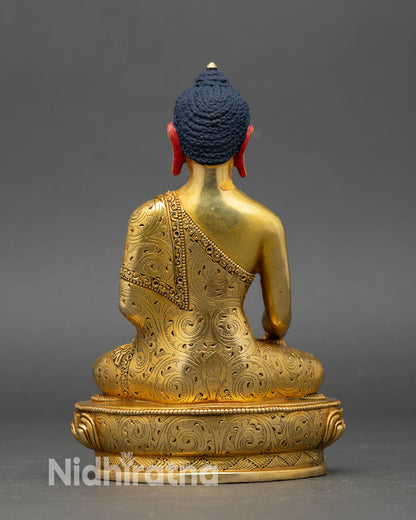 back view of shakyamuni buddha statue showing engraved patterns and sacred design