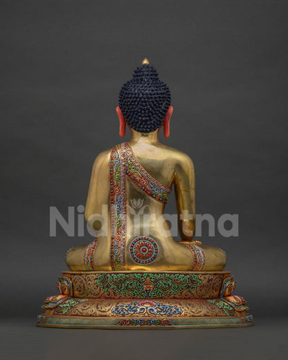 Back view of Shakyamuni Buddha statue Bangkok showing gold-gilded robe and lotus seat detailing