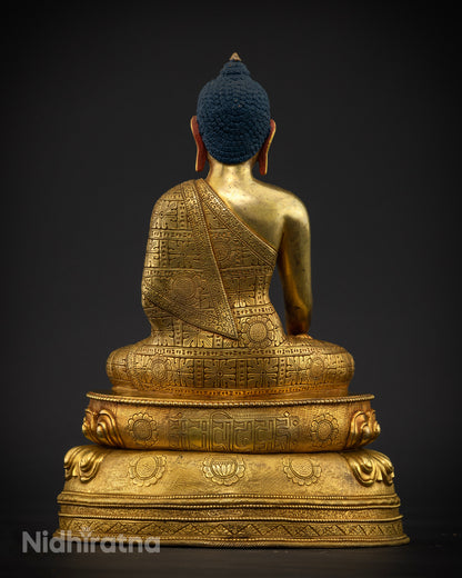 Back view of Shakyamuni Buddha Statue showing hand chased floral robe motifs