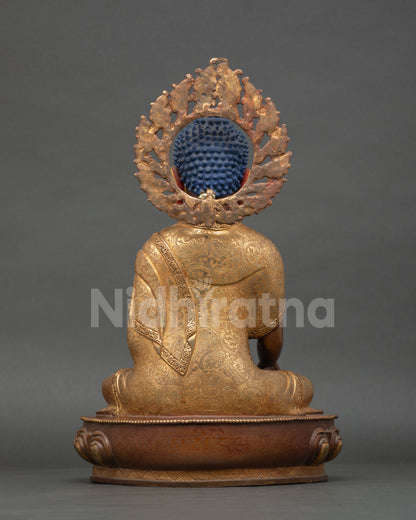back view of shakayamuni buddha statue showing oxidized copper finish and halo craftsmanship