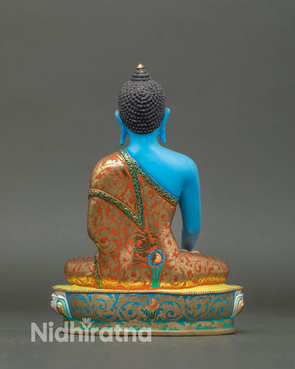 back view of shakyamuni buddha statue showing robe patterns and lotus seat details