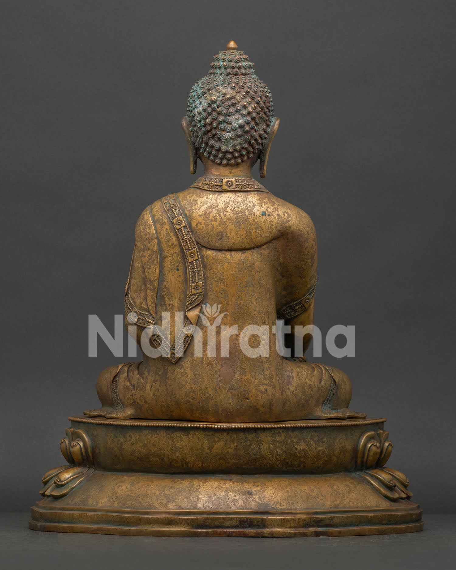 Back view of Shakyamuni Buddha statue with detailed handcarved robe and Nepalese craftsmanship.