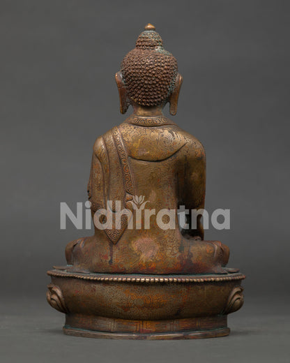 back view of shakyamuni buddha statue with detailed lotus seat design