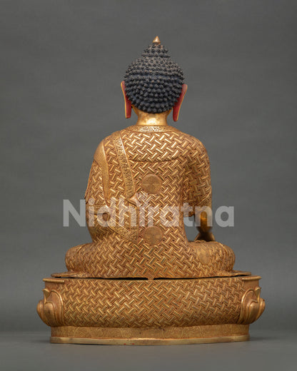 back view of shakyamuni buddha statue with detailed robe and halo design