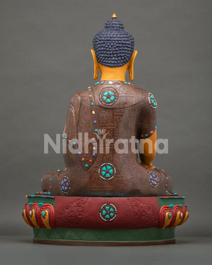 Back view of Shakyamuni Buddha statue with detailed robe engravings and handcrafted copper finish