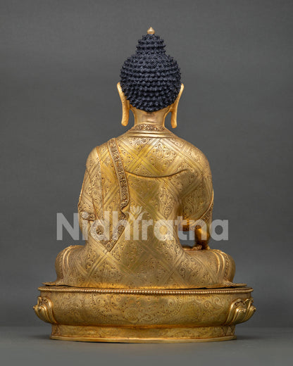 Back view of Shakyamuni Buddha statue with engraved lotus pedestal and handcrafted details