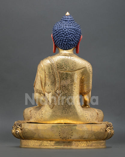 back view of shakyamuni buddha statue with engraved robe and copper alloy craftsmanship