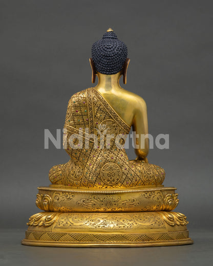 Back view of Shakyamuni Buddha statue with engraved robe patterns and handcrafted copper details from Nepal