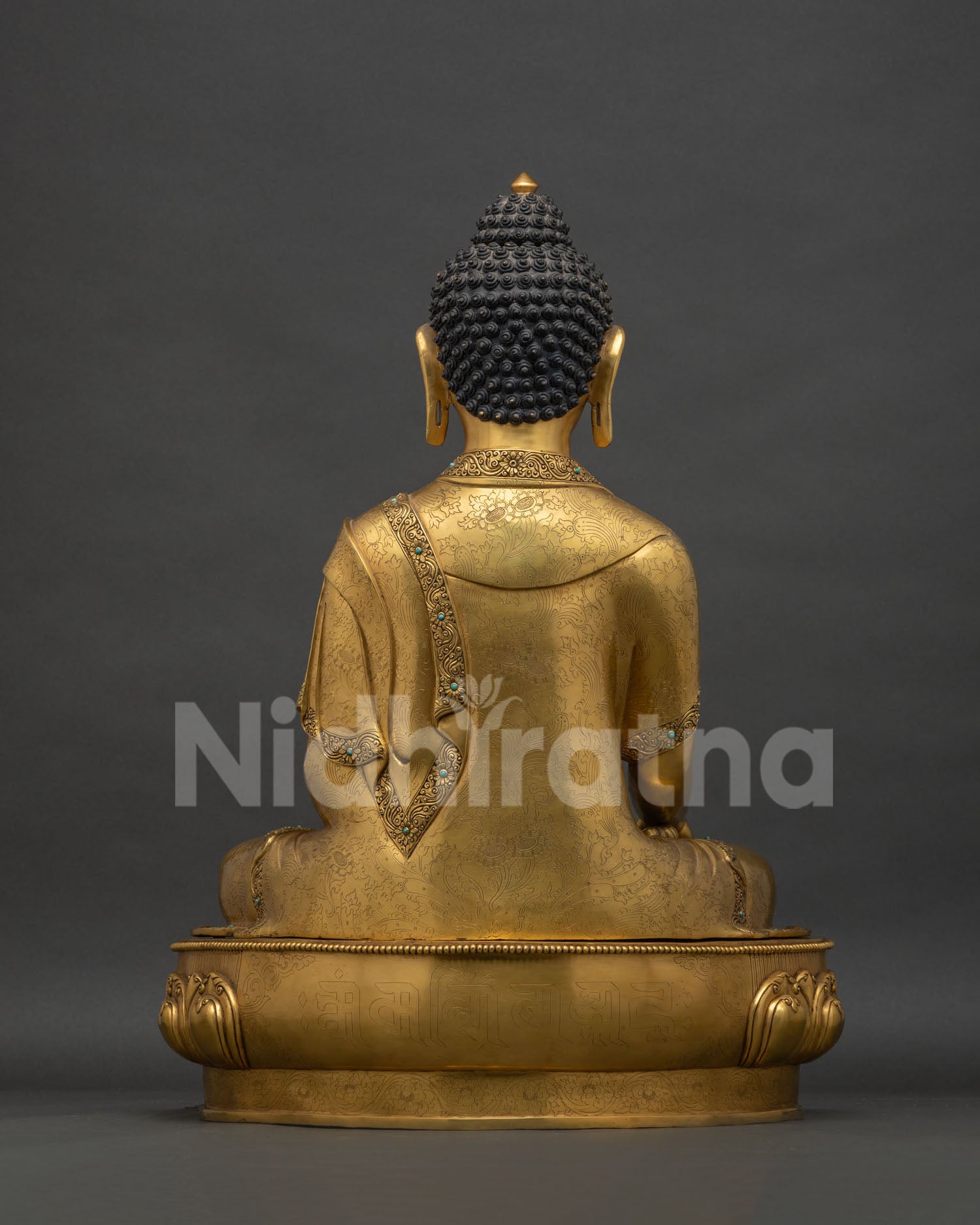 Back view of Shakyamuni Buddha Statue with hand-chased robe and floral carving