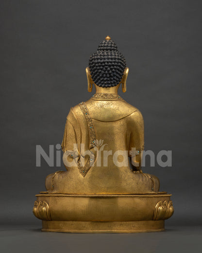 Back view of Shakyamuni Buddha Statue with hand-chased robe and floral carving
