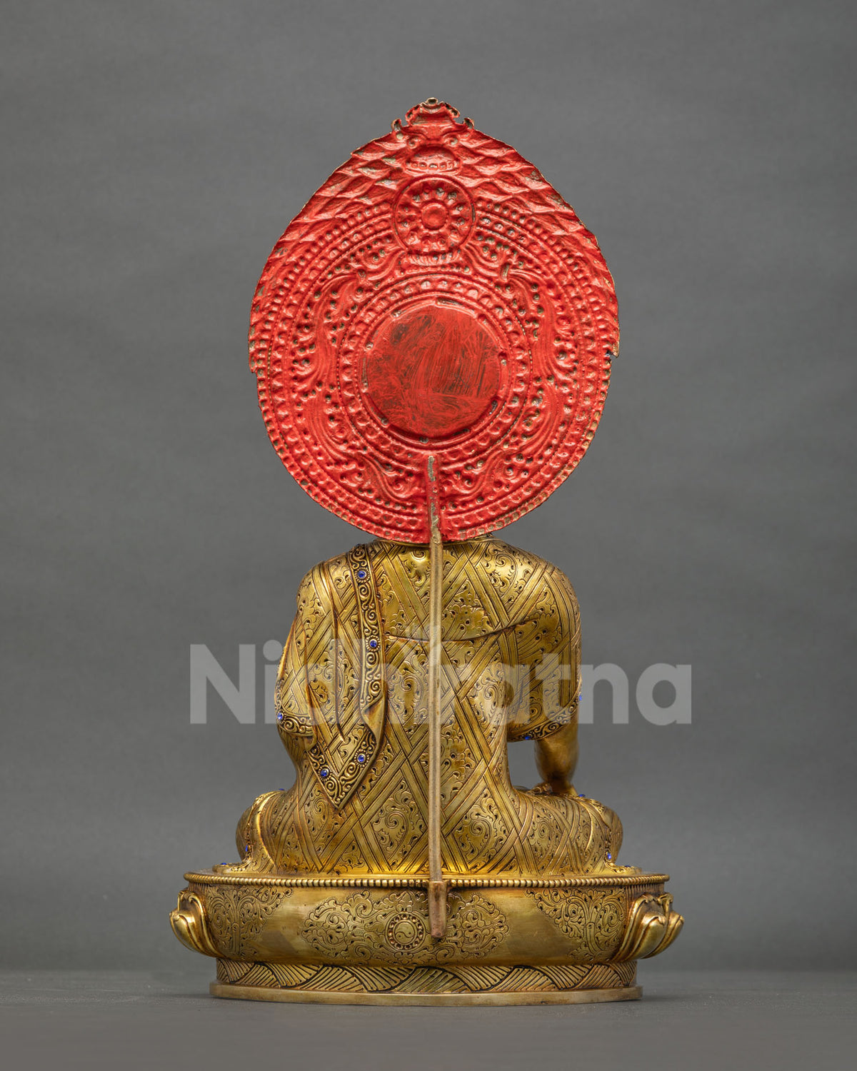 Back view of Shakyamuni Buddha statue with hand-engraved robe and lotus base, handmade in Nepal