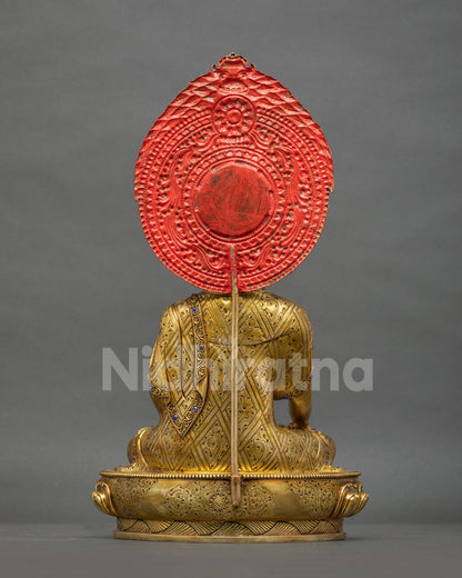 Back view of Shakyamuni Buddha statue with hand-engraved robe and lotus base, handmade in Nepal