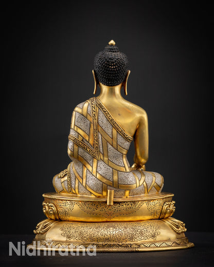 Back view of Shakyamuni Buddha statue with intricate copper craftsmanship and gold fire gilded finish showing detailed robe patterns and halo design