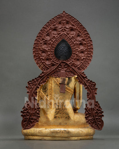 back view of Shakyamuni Buddha statue with ornate floral halo craftsmanship