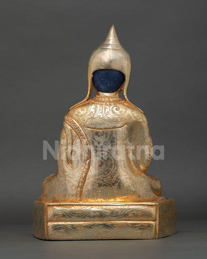 Back view of Shantarakshita statue showcasing detailed craftsmanship and gilding