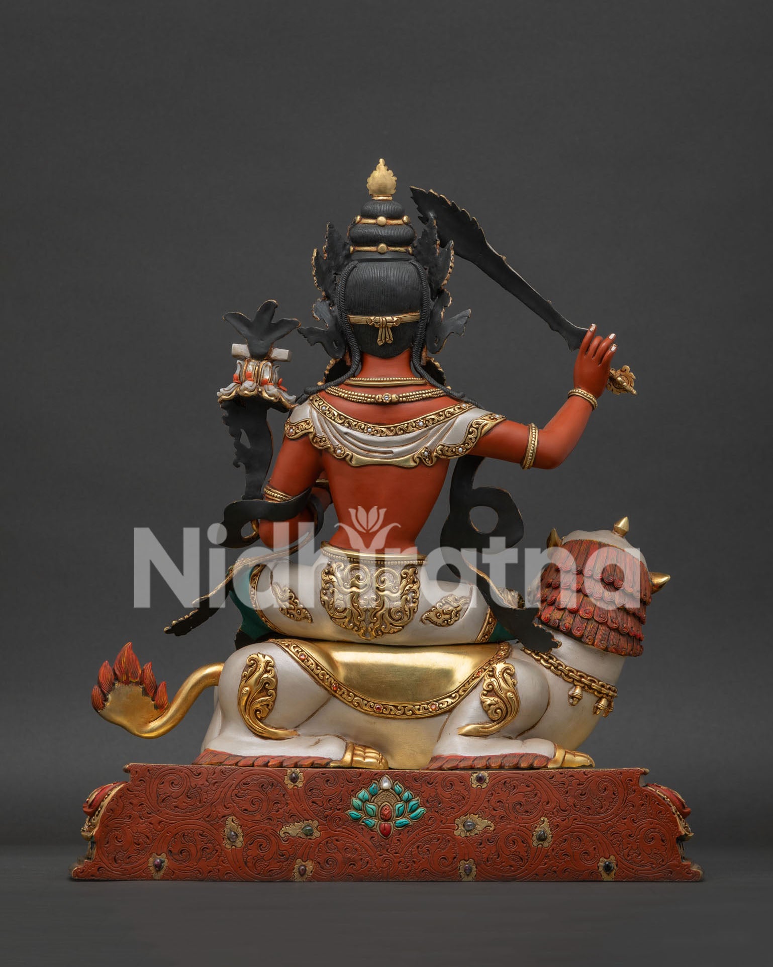 Back view of Simhanada Manjushri statue showing handcrafted Nepalese artwork