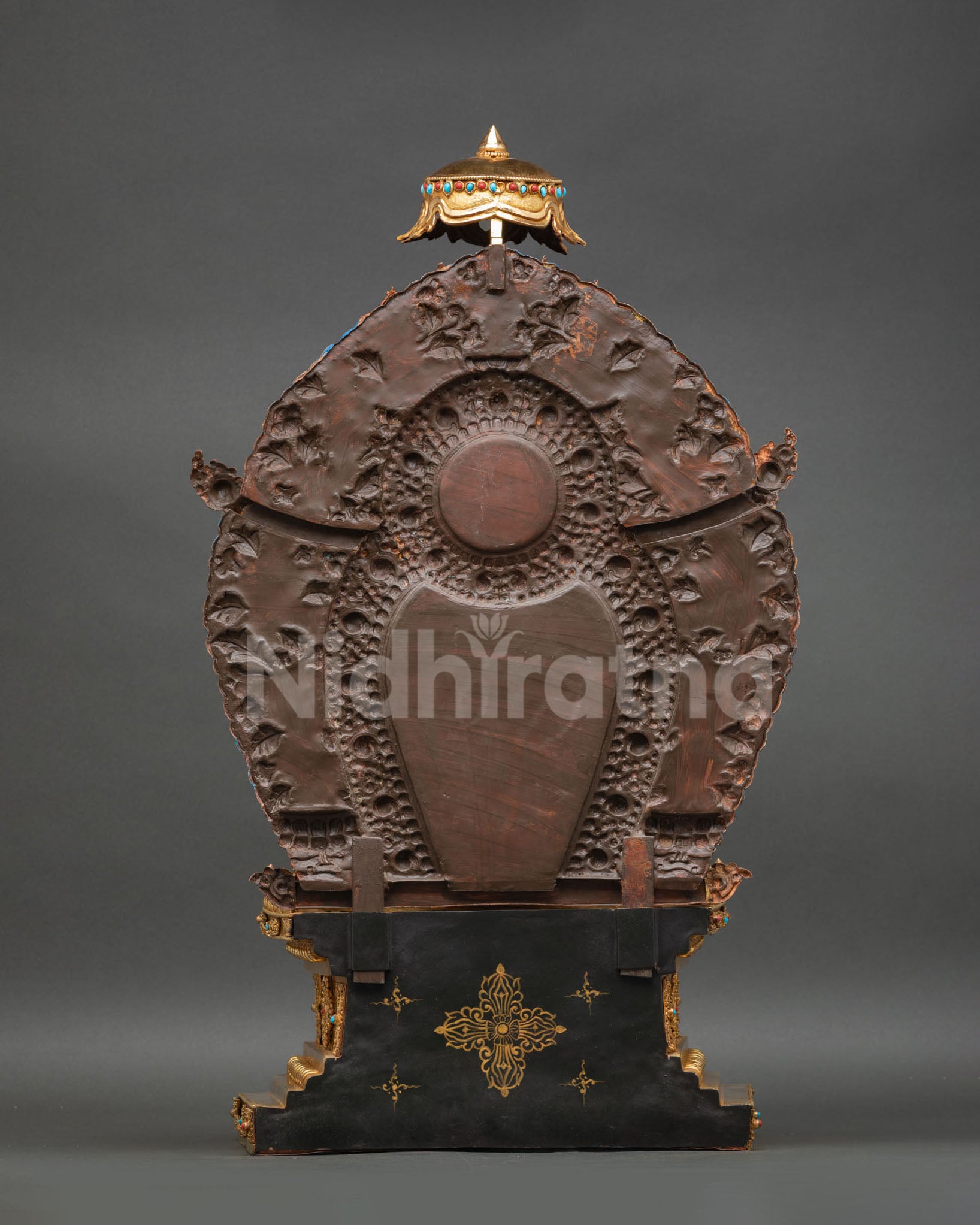 back view of simhanada manjushri statue with carved aureole and parasol throne
