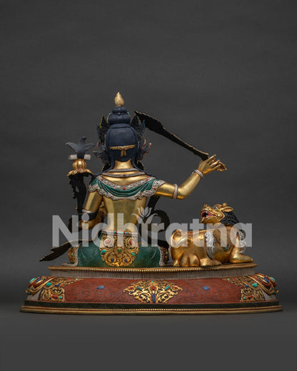 Back view of Simhanada Manjushri statue with silver-plated snow lion