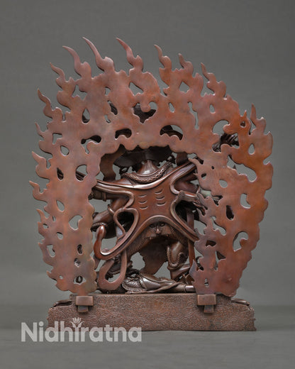 Back view of Six Armed Mahakala statue on lotus pedestal, flame halo, traditional Nepal Buddhist deity sculpture for home shrine and altar decor