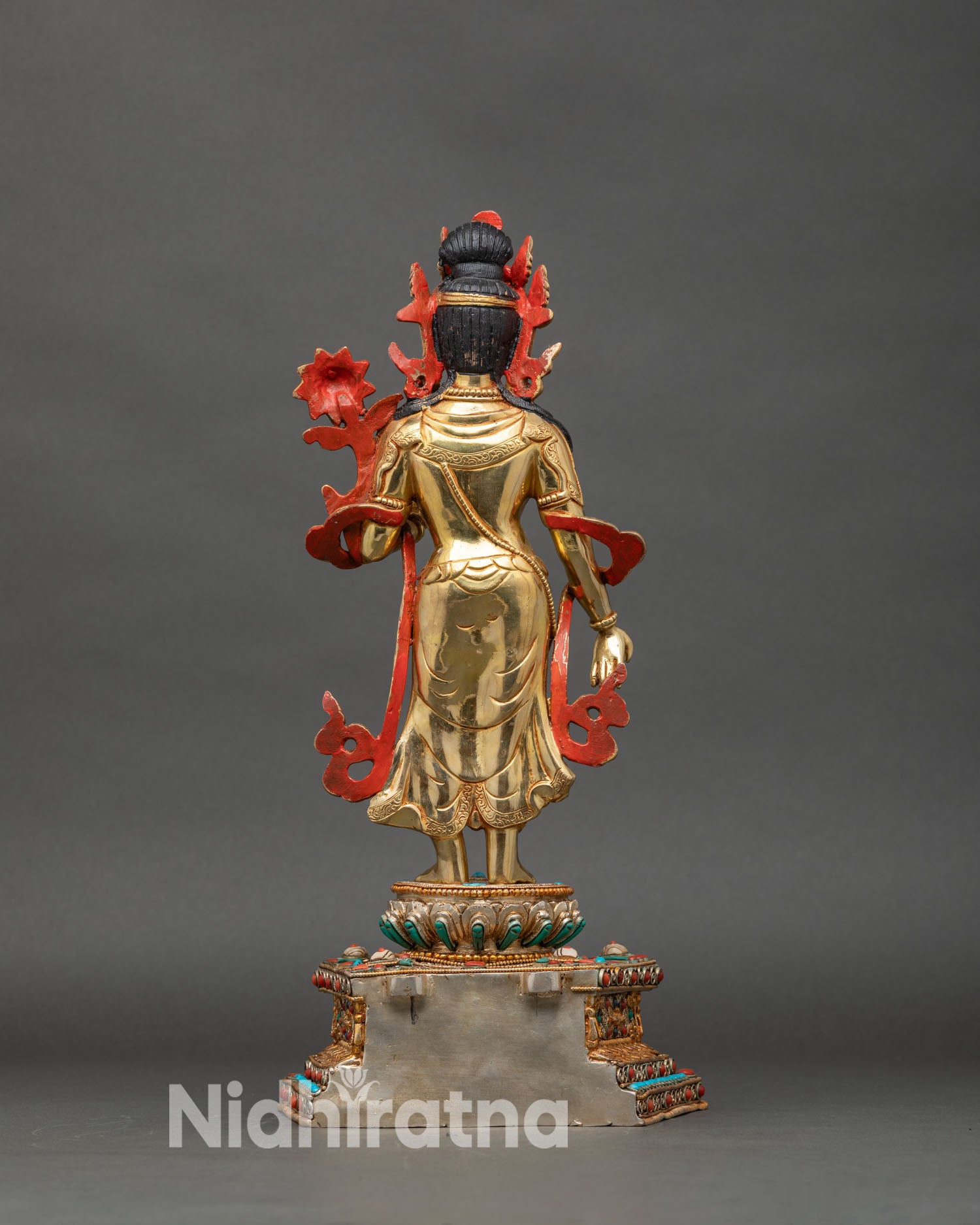 Back view of Standing Chenrezig statue, filigree halo and lotus seat with gold details