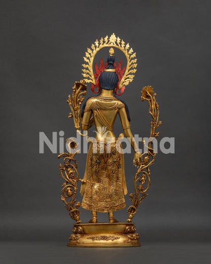 back view of standing green tara statue revealing intricate copper craftsmanship and halo