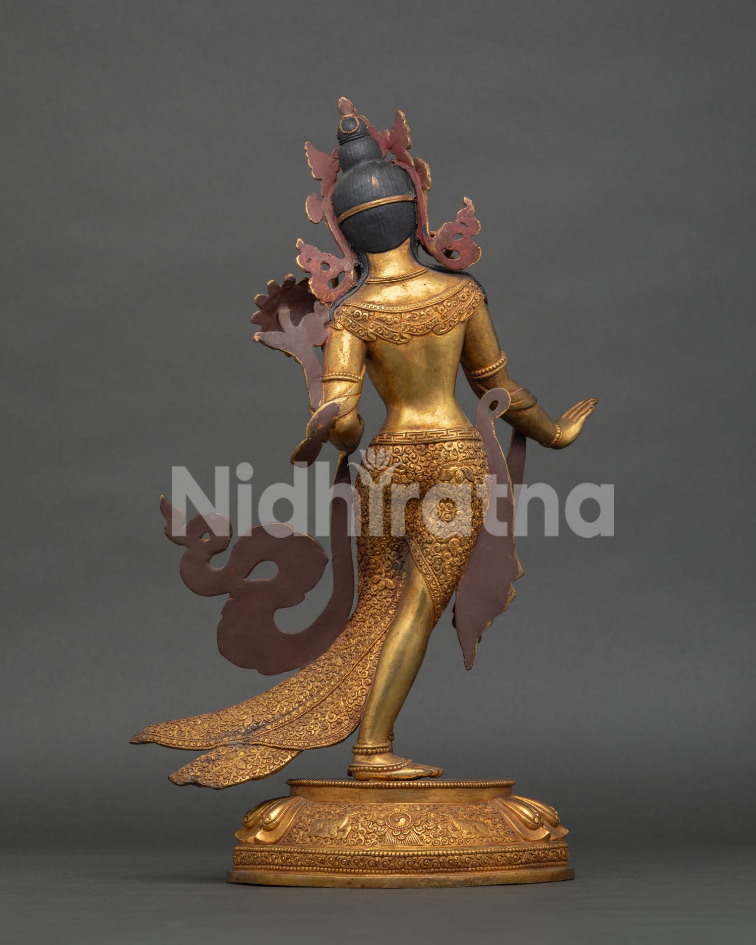 Back view of Standing White Tara statue revealing detailed copper carving and Himalayan Buddhist art