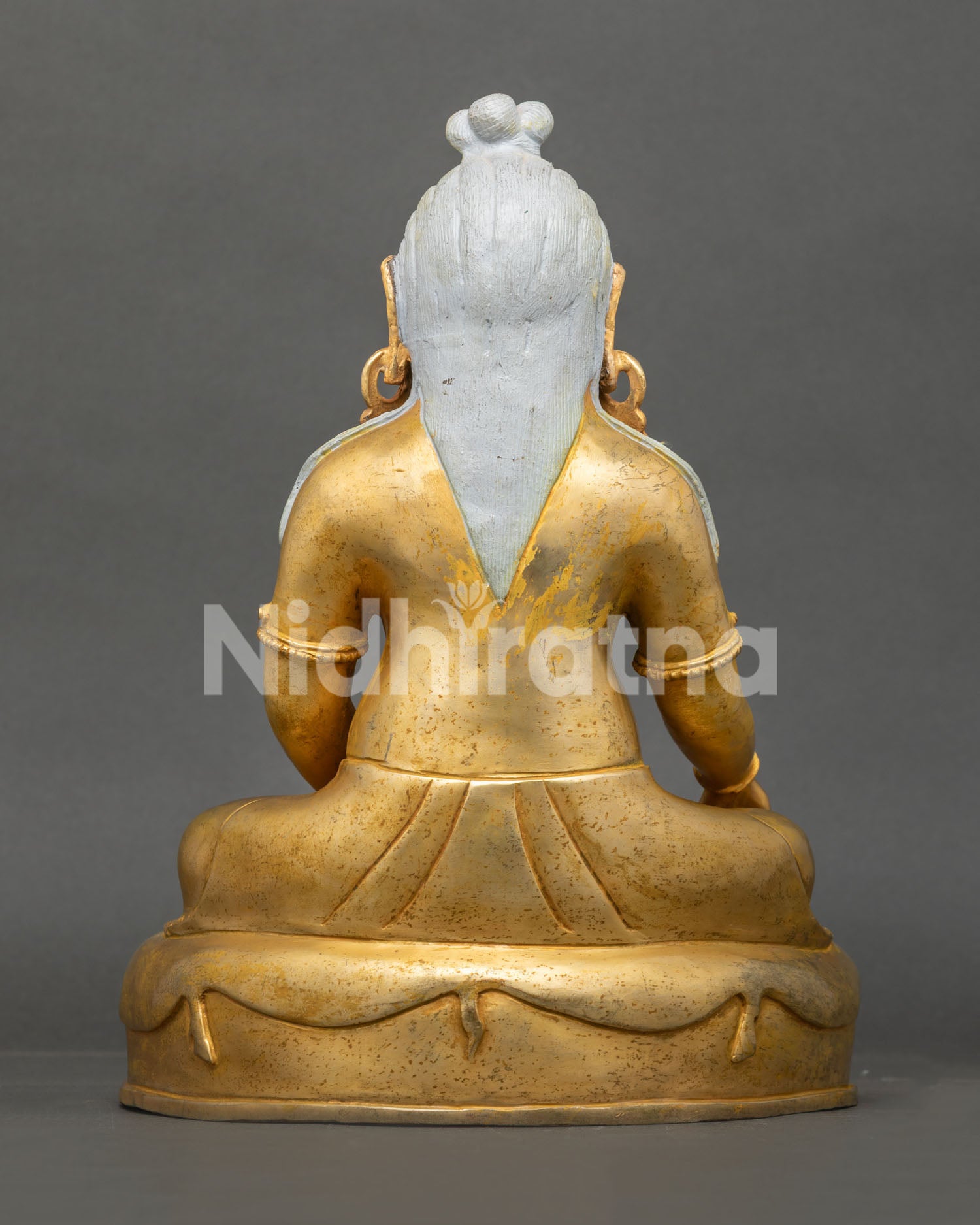 Back view of Thang Thong Gyalpo Statue with finely carved robes and traditional craftsmanship