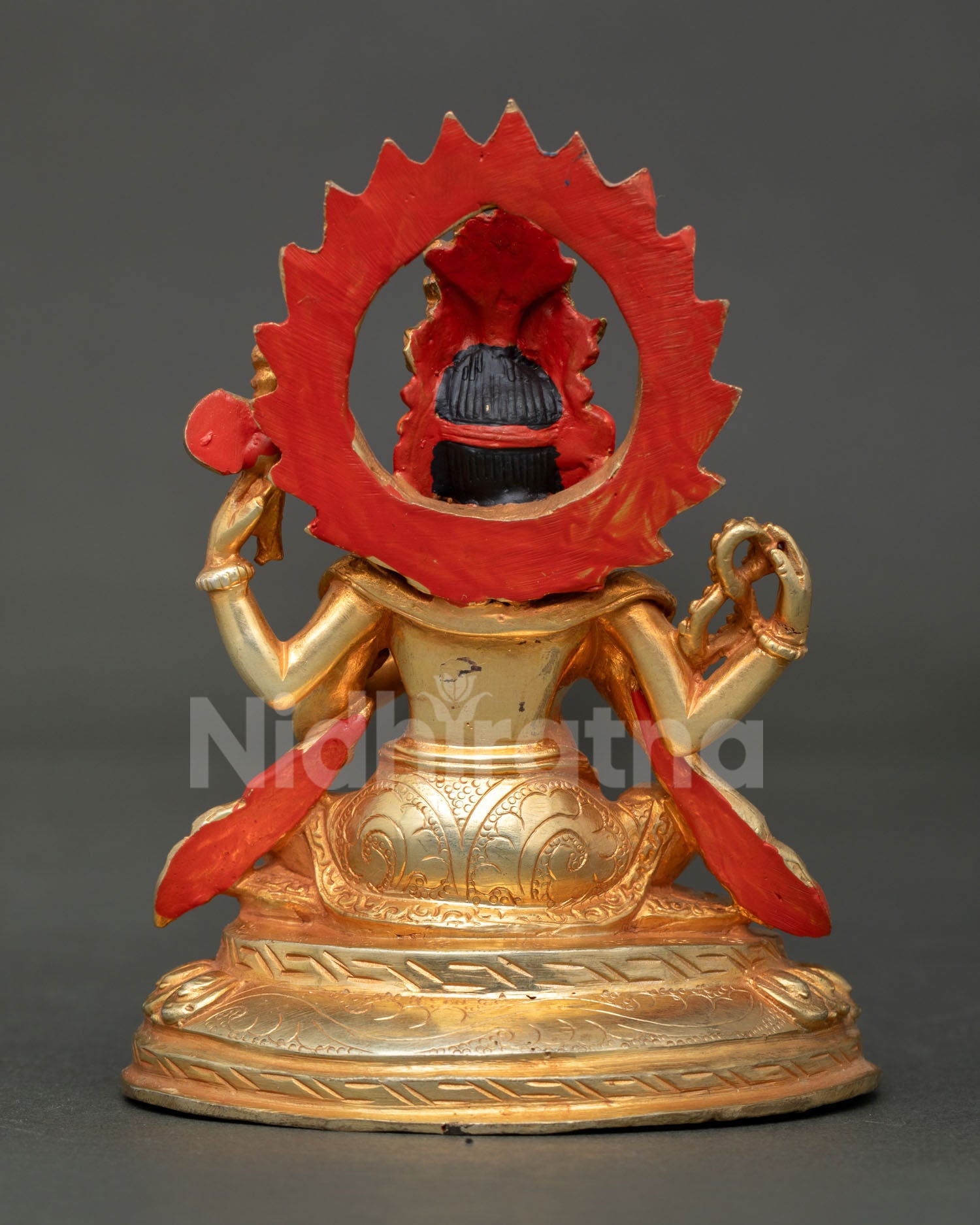 Back view of the Nepalese Lord Ganesha statue with a radiant halo and sacred craftsmanship