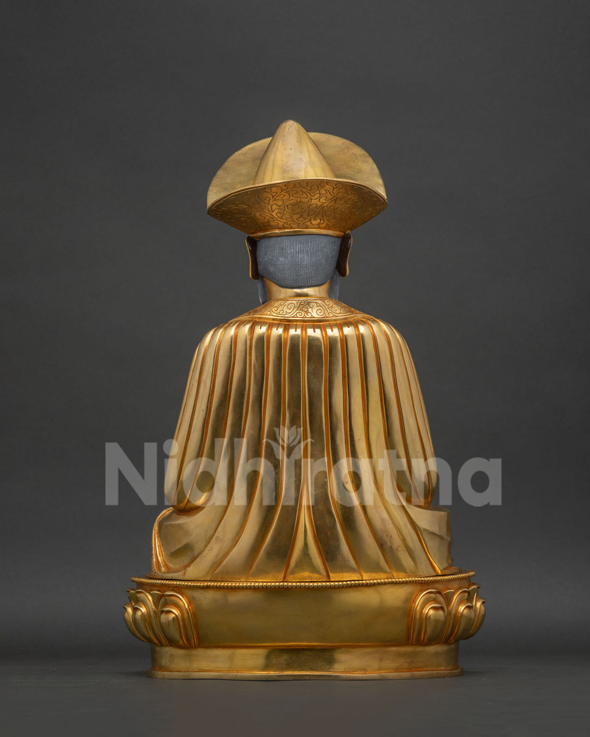 Back view of the Ngawang Namgyal statue showing hand-carved robe folds
