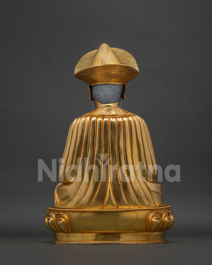 Back view of the Ngawang Namgyal statue showing hand-carved robe folds