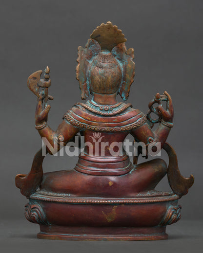 Back view of traditional Nepalese Ganesh sculpture with antique oxidized finish