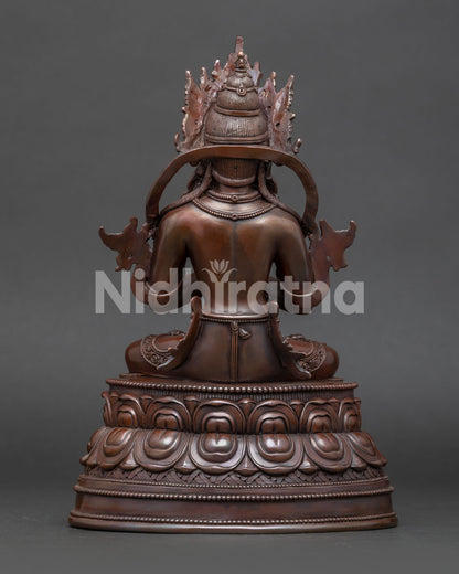 Back view of traditional Nepalese Vajradhara Buddhist sculpture with lotus pedestal