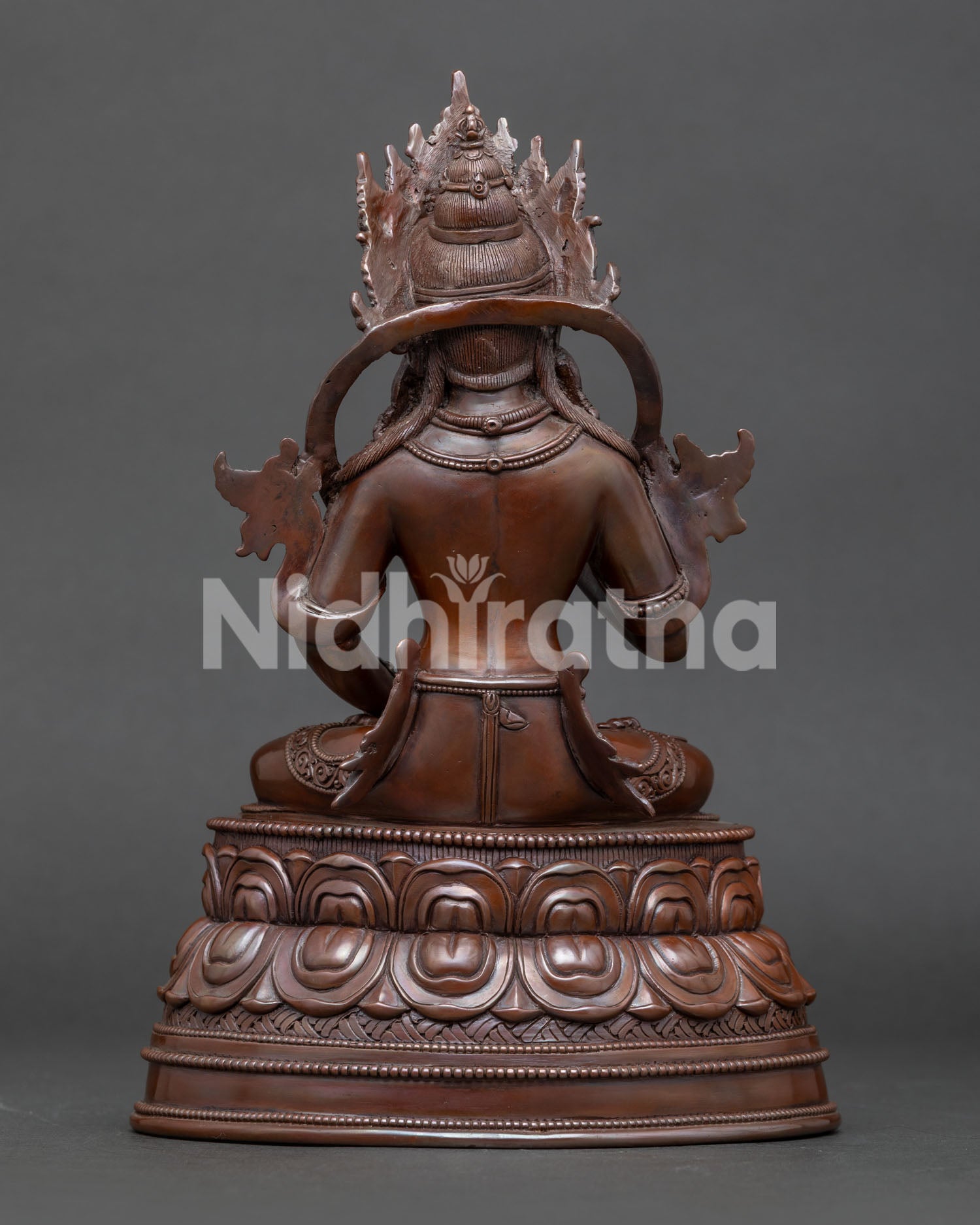 Back view of traditional Nepalese Vajrasattva sculpture with intricate metalwork details