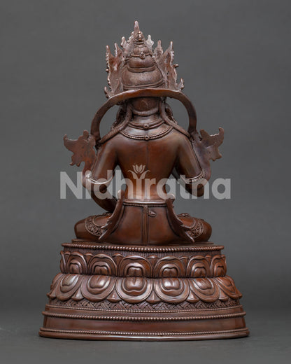 Back view of traditional Nepalese Vajrasattva sculpture with intricate metalwork details