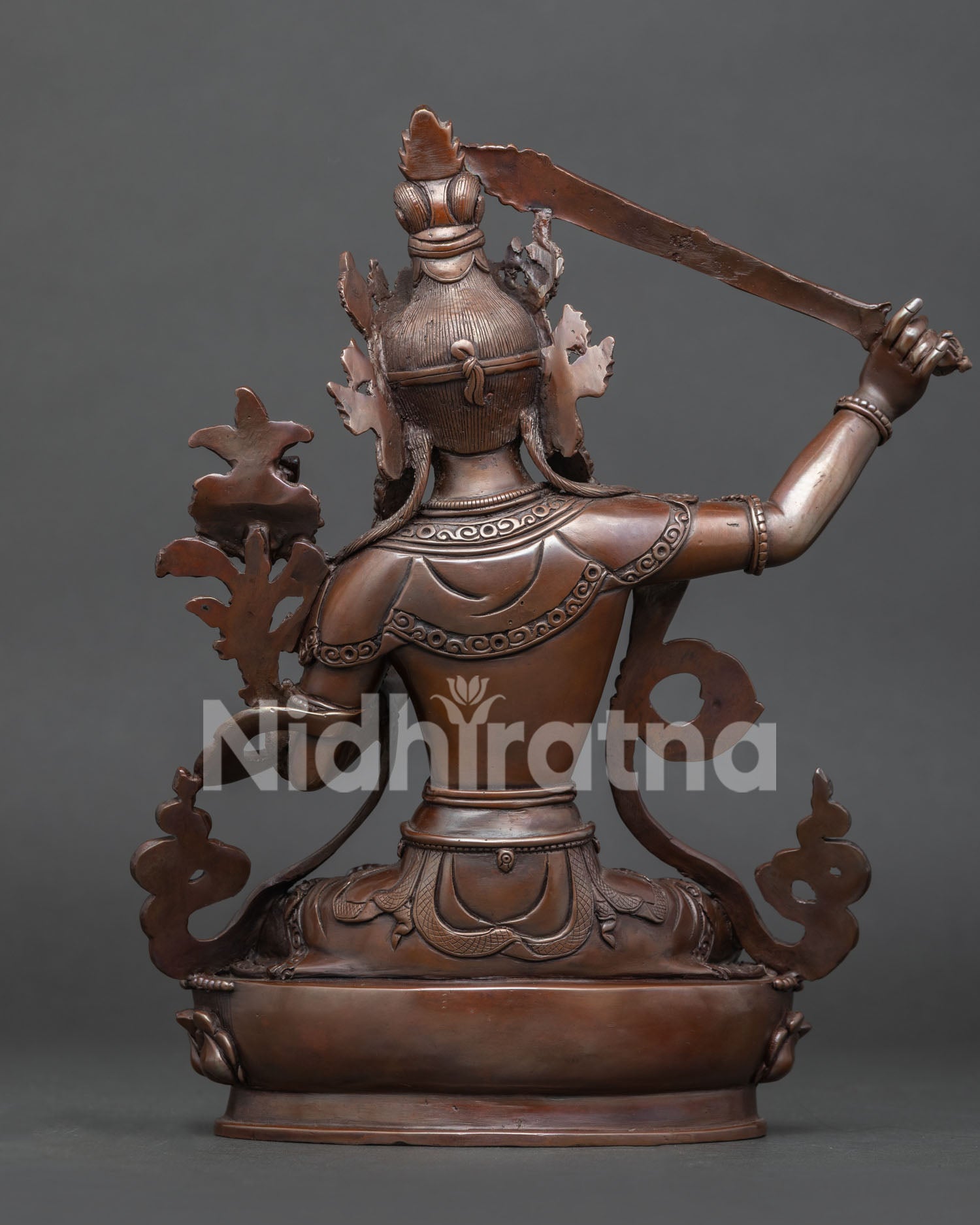 Back view of traditional Newari Manjushri sculpture with intricate metalwork details
