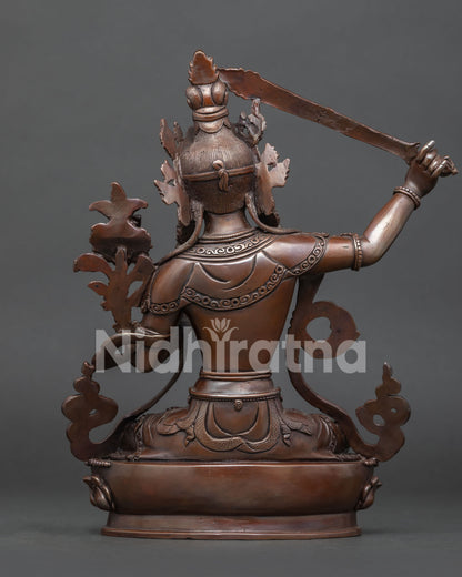 Back view of traditional Newari Manjushri sculpture with intricate metalwork details