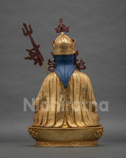 Back view of Tsokye Dorje statue showing engraved Tirpatika robe and gold fire-gilded lotus pedestal