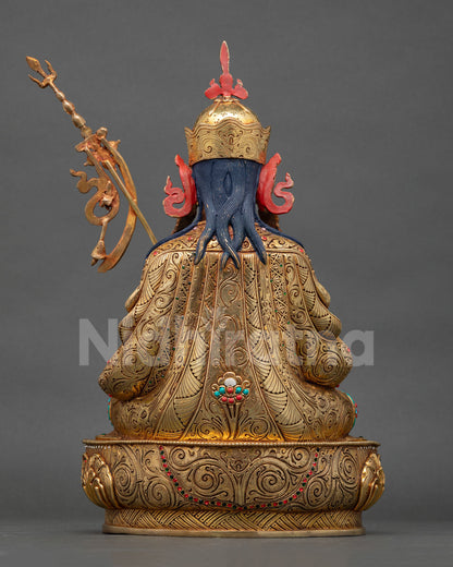 back view of tsokye dorje statue with detailed repoussé craftsmanship and lotus base
